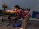 standing woman bends forward and reaches out with both arms
